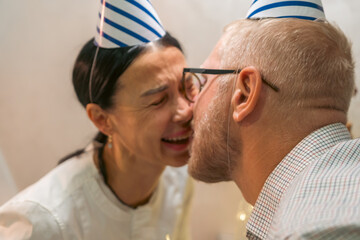 Here's a title attempting to follow all instructions: Couple Kissing Party Hats Celebration Indoor:...