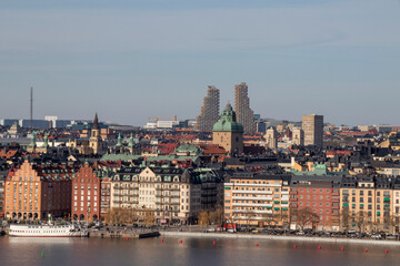Skyline of Stockholm with historic rooftops and modern high-rise buildings.
Panoramic cityscape of Stockholm with traditional rooftops and modern skyscrapers on a clear day