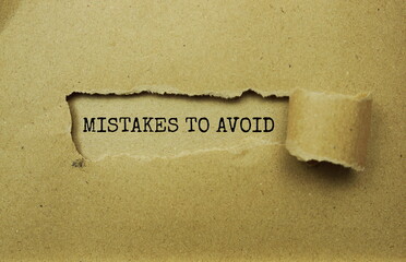 Mistakes To Avoid message written on craft paper with torn paper background