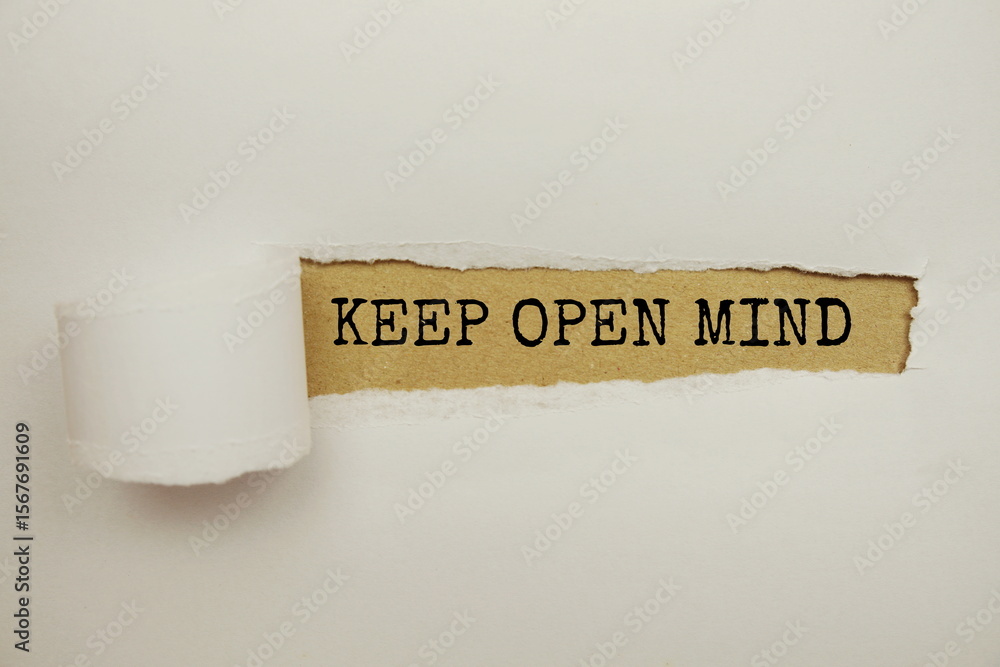 Poster keep open mind message written on craft paper with torn paper background