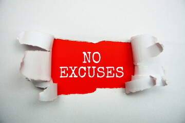 No Excuses message written on red paper with torn paper background