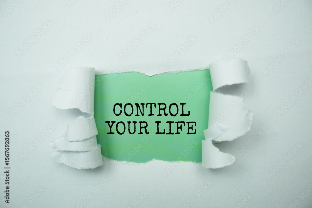 Poster take control of your life message written on green paper with torn paper background