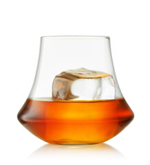 Glass scotch whiskey or brandy and one big piece ice on white background with clipping path