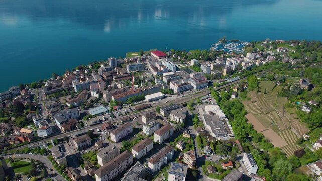 A panoramic aerial view around the city Clarens in Switzerland on a sunny spring noon