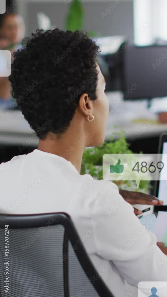 Poster animation of notification bars over diverse female coworkers discussing reports on computer
