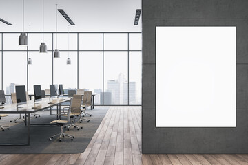 Modern empty open space office interior with vertical blank poster mockup on wall and panoramic city view through glass windows in background. 3D Rendering