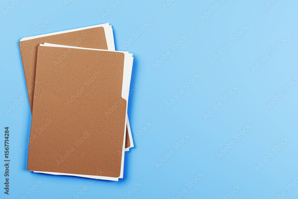 Poster brown file folders with blank white documents on light blue background, top view with empty space fo