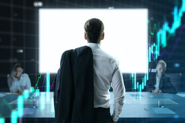 Businessman stands with jacket over shoulder in conference room, analyzing digital stock market...