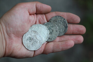 Huge medieval european silver coins in hand