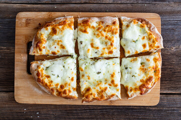 Pinsa bianca white pizza with oregano on wooden table