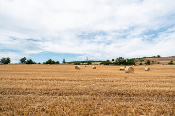 Scenic view over the hay bales