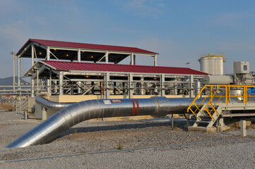 Oil pipe in an oil field. Translation of the inscription: Oil.