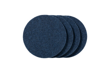 Four dark blue felt coasters arranged in a row isolated on transparent background