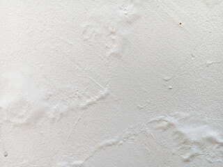 Abstract texture of blistering or bubbles paint on a white wall.	