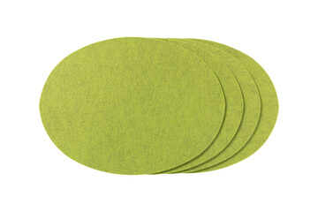 Four round lime green felt placemats stacked together isolated on transparent background