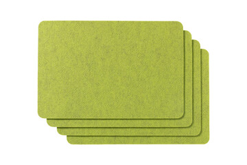 Stack of four lime green felt placemats with rounded corners isolated on transparent background