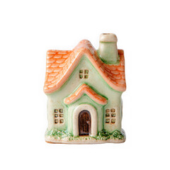 Charming ceramic fairy tale cottage with orange roof and green walls isolated on transparent background