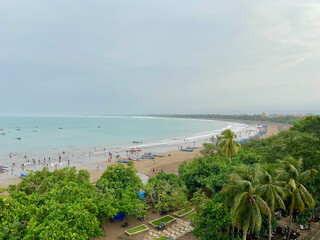 Overcast Aerial View of Pangandaran Beach Crowded with Tourist Activity Scene