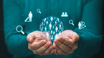 Hands hold a glowing blue-white holographic network orb with interconnected human icons, surrounded by floating tech symbols, sparkles, and dark teal background