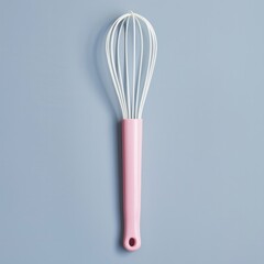 Positioned vertically on the left, the whisk has long, thin white wires and a pink handle.