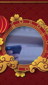 Animation of chinese frame over hand paying with smartphone