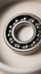 Close-up of a shiny new ball bearing showing smooth metal surfaces and precision engineering, suggesting durability and reliability, ideal for industrial themes and engineering concepts .