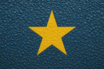 Yellow star set against a stone blue background