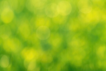 Obraz premium Fuzzy abstract backdrop featuring glowing green and yellow bokeh highlights