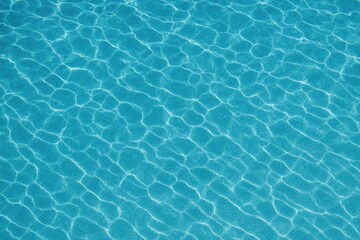 Aerial view of a vibrant patterned ocean surface in shades of blue