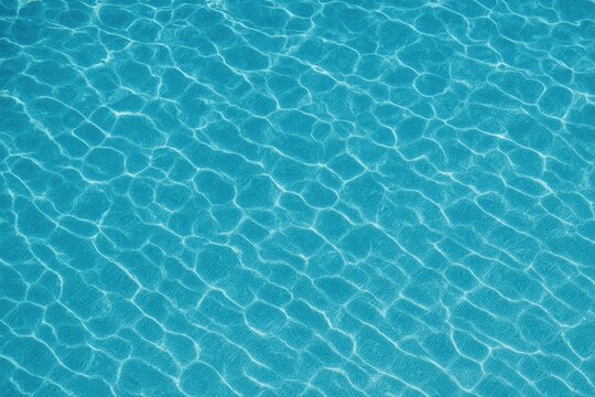 Aerial view of a vibrant patterned ocean surface in shades of blue