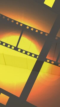 Animation of film tape and countdown on yellow background