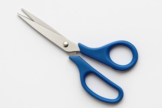 Blue scissors shown in a typical use scenario for cutting paper, fabric, or packaging materials, intended for commercial representation of office and craft supplies.
