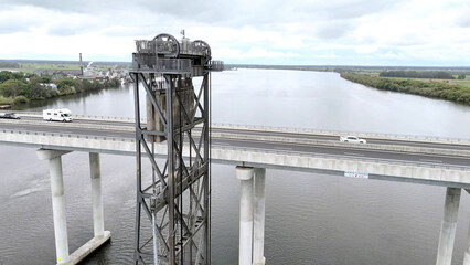A stunning Aerial View of Pacific Highway Harwood Bridge crosses the Clarence River under a cloudy sky in the Northern Rivers region of New South Wales, Australia 
