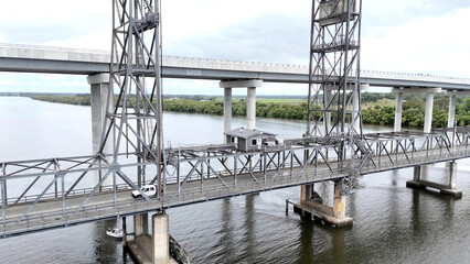 A stunning Aerial View of Pacific Highway Harwood Bridge crosses the Clarence River under a cloudy sky in the Northern Rivers region of New South Wales, Australia 