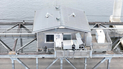 A stunning Aerial View of Pacific Highway Harwood Bridge crosses the Clarence River under a cloudy sky in the Northern Rivers region of New South Wales, Australia 