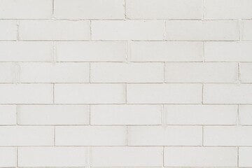 DIY white brick wall constructed from drywall fragments