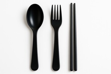 Melamine utensils including spoon, fork, and chopsticks displayed on a white backdrop