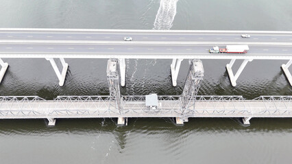 A stunning Aerial View of Pacific Highway Harwood Bridge crosses the Clarence River under a cloudy sky in the Northern Rivers region of New South Wales, Australia 