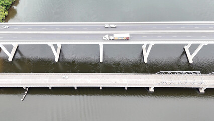 A stunning Aerial View of Pacific Highway Harwood Bridge crosses the Clarence River under a cloudy sky in the Northern Rivers region of New South Wales, Australia 
