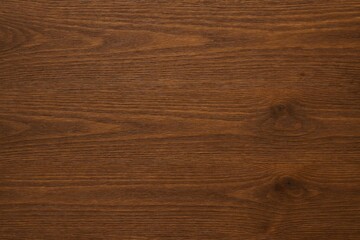 Wooden brown background with ample space for text and design, viewed from above.