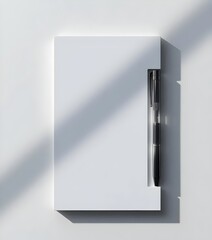 Minimalist Stationery: A sleek black pen rests elegantly against a pristine notepad, its simple design creating an atmosphere of focus and organization.