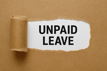 Business concept illustrating unpaid leave with torn brown paper on a white surface