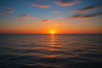 Naklejka premium Sunset over the water's edge captured beautifully