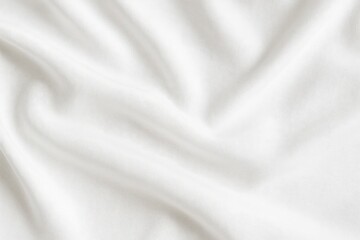 Elegant white cotton fabric showcasing smooth wave patterns on a neutral background for product display or advertising. Top-down perspective or flat lay style.
