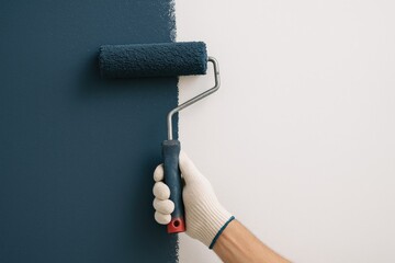 Painter applying dark blue paint to wall surface during renovation, leaving space for additional notes
