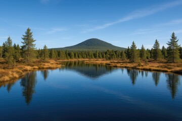 Fototapeta premium Stunning view of a freshwater body nestled in a protected natural area with surrounding hills in a German region.
