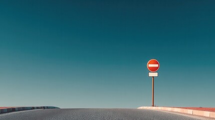 Empty Road with No Entry Sign Under Clear Blue Sky