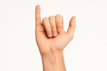 Young Caucasian man's hand displaying fingers on a plain white background, emphasizing the pinky finger for a pledge of loyalty