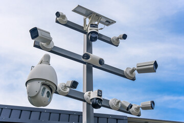 Street surveillance cameras of different modifications on one stand