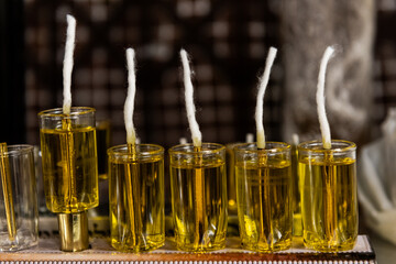 Glass vials filled with oil and new wicks in preparation for lighting the Hanukkah menorah on the Festival of Lights in Israel.